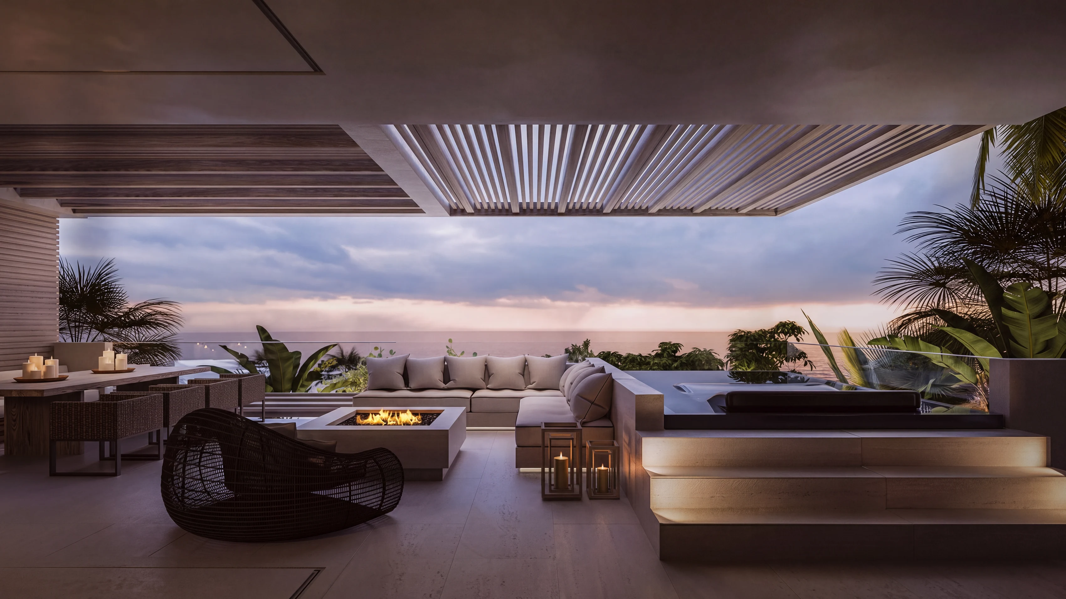 A terrace at dusk with the sea beyond